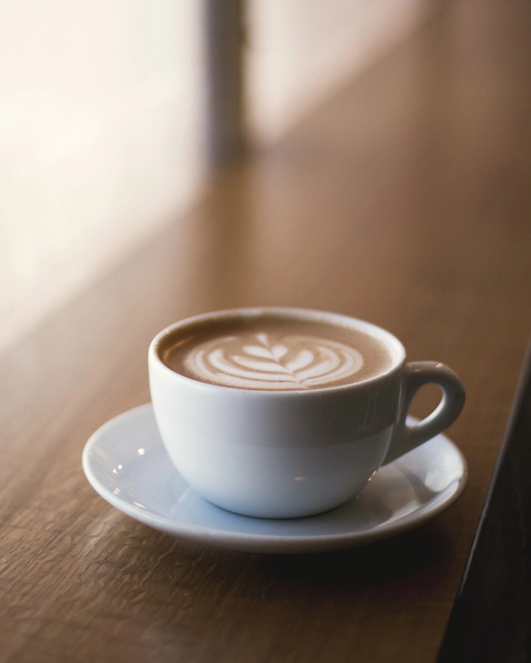 Coffee being poured in warm morning light